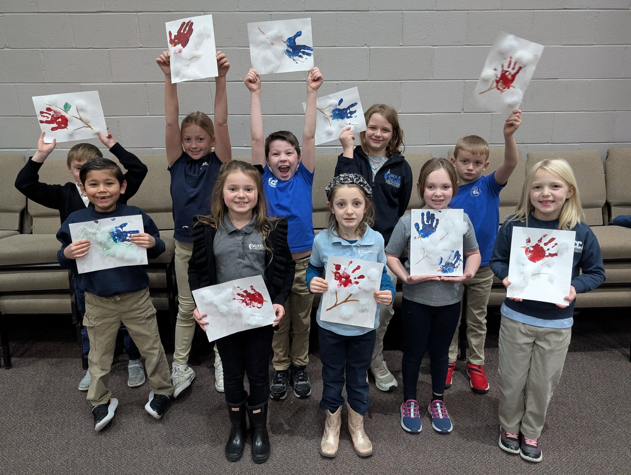 CCA elementary students displaying colorful classroom artwork