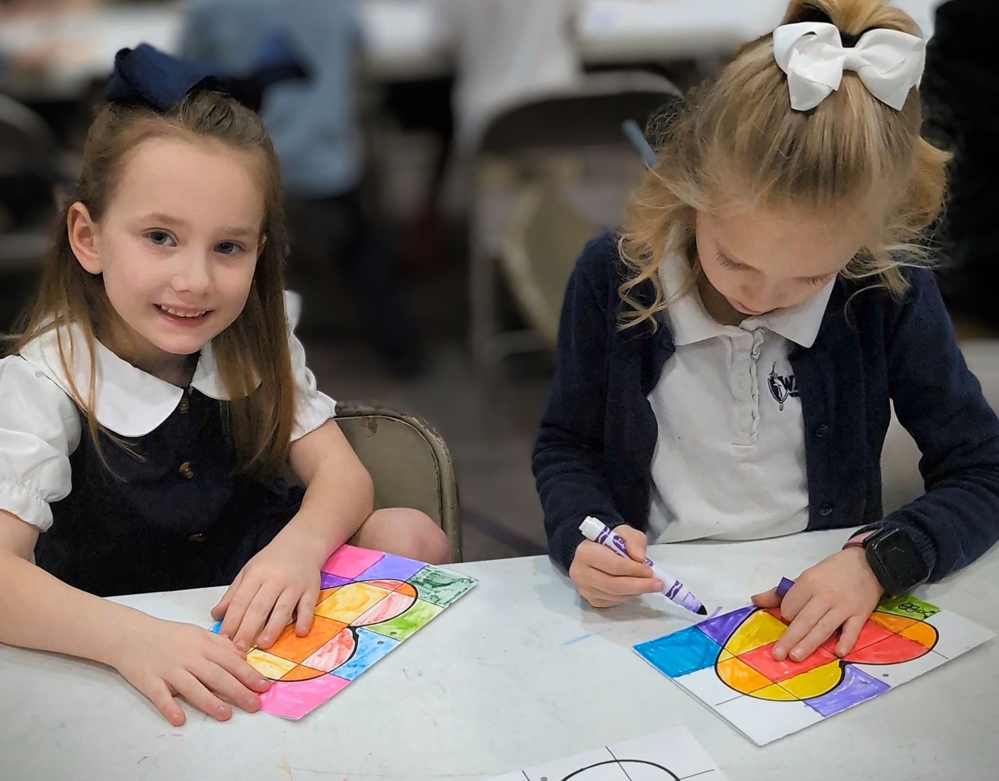 CCA students learning together around a classroom table